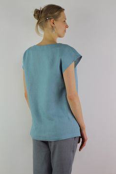 "Handmade turquoise linen blouse with short sleeves, perfect for casual wear and suitable for any occasion in any season Details: - 100% natural linen produced in Europe ; - medium weight (180 gram per square meter); - color: turquoise, can be any from our colors catalog (color samples at the photo); Made to order, approximately a few days, If you have any questions please message me and I will be glad to answer. Size guide : Size XS Bust: fits bust around 33\"-34\"/ 84-88 cm Waist: fits waist a Light Blue Linen Short Sleeve Top, Light Blue Linen Summer Blouse, Turquoise Short Sleeve Tops For Spring, Casual Turquoise Short Sleeve Blouse, Light Blue Relaxed Fit Linen Tops, Relaxed Fit Light Blue Linen Tops, Blue Linen Short Sleeve Top, Turquoise Short Sleeve Top For Summer, Turquoise Relaxed Fit Short Sleeve Top