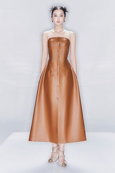 This luxurious leather midi dress boasts an elegant A-line silhouette and sleeveless design. Perfect for making a statement at any upscale event or for a night out on the town. Its tassel detail adds a touch of sophistication and artistry to this timeless piece. *Note: The length is difference approx 2cm Brown A-line Midi Dress For Evening, Luxury Sleeveless Midi Dress For Gala, Brown A-line Midi Dress For Party, Luxury Brown Party Dress, Leather Midi Dress, Mean Blvd, Ankle Length Dress, Designer Collection, Timeless Pieces