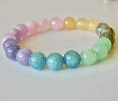 Handmade Pastel Ombré Crystal Bead Bracelet: Crafted with care and attention to detail, this exquisite bracelet combines the beauty of 8mm crystals with powerful gemstone energies.  Here's why you'll love it: Labradorite Transformation: Strengthen your will and ignite your imagination. Labradorite is known for its mystical properties that encourage positive change and inner growth. Burmese Jade Stability: Experience serenity and wisdom. Burmese Jade brings balance, longevity, and a sense of tran Crystal Bead Bracelet, Mother Love, Crystal Beads Bracelet, Spiritual Awareness, Rare Gemstones, Quartz Rose, Bead Bracelet, Crystal Beads, Citrine