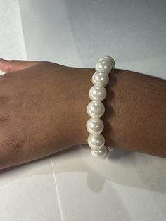 Beautifully handmade white imitation pearl bracelet. Adjustable Pearl White Bracelet With Pearl Drop, Pearl White Adjustable Pearl Charm Bracelet, Beaded Pearl White Round Bracelet, Adjustable Pearl White Beaded Bracelets With Pearl Drop, Pearl White Beaded Round Pearl Bracelet, Adjustable Pearl White Bracelets With Pearl Chain, Adjustable Pearl White Bracelet With Pearl Chain, Pearl Beaded Bracelets With 8mm Beads, Adjustable Pearl Bracelet With Round Beads