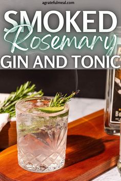 a gin and tonic cocktail with rosemary garnish on the rocks in front of it