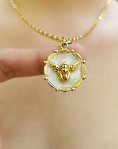 "✨ Gold plated angel pendant necklace (cherubim necklace) for women will make a perfect gift for your girlfriend, any woman, and even yourself. ♥️ The necklace contains an angel shape, melted nacre (white area), and a small evil eye (which can be detached easily on demand). ✨ It is made of 24K gold plated metal. ♥️ The materials used are first quality. ✨ The chain length is fully adjustable as your wish. ✨The chain is also plated with rhodium, making it shinier and resistant to oxidation and tarnish. ♥️ 100% satisfaction guarantee; Return it within 14 days if you feel unsatisfied. ✨ Please don't hesitate to get in touch with me with any questions. SPECIFICATIONS -- Materials: 24K gold plated metal -- Necklace Length: approx. 70 cm/27\" long and fully adjustable -- Total Weight: approx. 15 White Plated Necklaces As Gift, White Plated Pendant Necklaces, White Plated Pendant Necklace, Pendant Charm Necklace As Gift, Charm Pendant Necklace For Gifts, Plated Pendant Charm Necklaces As Gifts, Angelic Gold Necklaces As Gifts, Angelic Gold Necklaces For Gifts, Angelic Gold Necklace For Gift