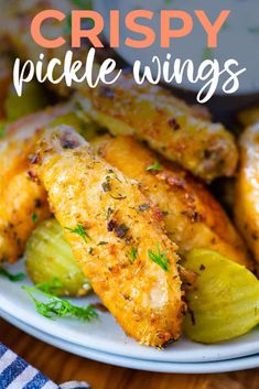 chicken wings on a white plate with pickles and parsley in the background text reads dill pickle chicken wings