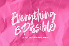 pink crumpled paper with the words everything is possible written on it in white ink against a magenta background