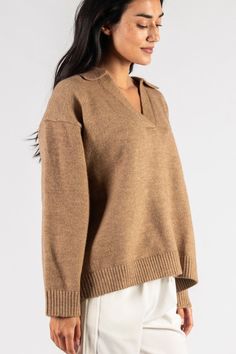 A top that both looks good and keeps you cozy. This sweater top is ready for fall. Details: - Collared - Long sleeve - V neck - Ribbed knit Cozy Soft Knit V-neck Sweater For Work, Knit V-neck Sweater With Ribbed Collar For Fall, Beige V-neck Sweater For Fall Layering, Beige Soft Knit V-neck Sweater For Fall, Casual Brown V-neck Sweater For Work, Beige V-neck Sweater For Fall Loungewear, Oversized Cozy Workwear Tops, Oversized Neutral V-neck Sweater, Knit V-neck Sweater For Fall Layering