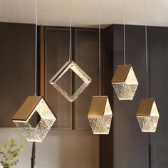 four hanging lights in the shape of cubes