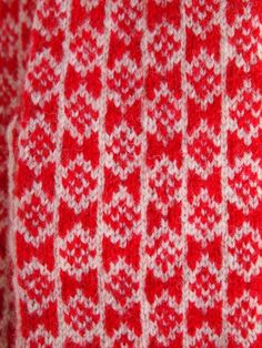 Knitted with two colored yarn (red and white) in traditional Estonian fair-isle style. The off-white yarn is natural undyed sheep color, red is hand dyed in Estonia, 100% wool. Tightly knitted using 0-size needles and DK-weight yarn, they are perfect to block wind and wear in winter. These mittens' wrists are edged with a handy ribbon, which makes it convenient to hang to dry or store.The pattern used here is a traditional motif from Rapla County, Estonia.Women's size, also available for custom Hand Knitted Cozy Winter Patterns, White Hand Knitted Patterns For Winter, Cozy Knitted Winter Patterns, Red Casual Hand-knitted Knitting Pattern, Nordic Style Handmade Winter Knitting Pattern, White Nordic Knitted Patterns, Winter Nordic Knitting Pattern, Nordic Fair Isle Knitting Pattern, Scandinavian Style White Fair Isle Pattern