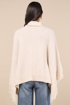 We love to bundle up in style with the Lulus Eclectic Attitude Cream Knit Turtleneck Fringe Poncho Sweater! Super soft and stretchy sweater knit shapes this Boho sweater with a cozy turtleneck and a wide-cut, oversized bodice that boasts poncho-style sleeves with fun fringe trim. Contrasting ribbed knit accents the neckline and split hem. Fit: This garment fits true to size. Length: Size medium measures 23.5" from shoulder to hem. Bust: Great for any cup size. Waist: Not Fitted - comfortable roo Fringe Poncho, Sweater Turtleneck, Boho Sweater, Fringed Poncho, Poncho Style, Knit Turtleneck, Poncho Sweater, Fringe Trim, Cup Size