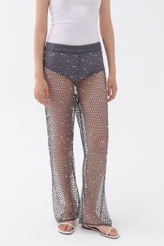 These high waisted mesh pants with an elastic waistband and glitter thread offer a fashionable and flattering design, perfect for enduring your busy lifestyle from day to dinner. Dry clean Material: 100% Polyester High rise Officially licensed Imported Brand: Nocturne Model Product Size: S Model Size: Height 5'10 / Bust 29.5 in / Waist 23 in / Hips 34 in True the size Sequined Bottoms For Summer Evenings, Sequined Bottoms For Summer Evening Events, Summer Evening Bottoms With Sequins, Glamorous Evening Bottoms For Summer, Glamorous Evening Summer Bottoms, Glamorous Summer Evening Bottoms, Chic Mesh Bottoms For Summer, Chic Sheer Mesh Bottoms, Summer Fishnet Bottoms