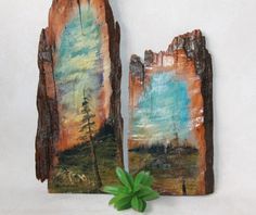 two pieces of wood that have been altered to look like paintings on the side of a wall