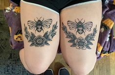 two tattoos on the legs of women with flowers and bees in them, one is black and white