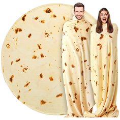 a man and woman dressed in burritos standing next to each other