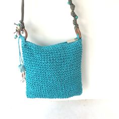 This Sun N Sand Woven Shoulder Bag In Bright Blue With Beaded Shoulder Strap is in very good condition. There are no rips, stains, missing stitches or unpleasant odors. This bag is clean inside and out. The interior of the bag has one zippered pocket, and one gusseted slip pocket. There is a zipper closure at the top of the bag. It is lined in solid blue polyester fabric, as pictured. It measures approximately: Length:                8.5" inches  Height:                9.0" Depth: Cute Crochet, Bright Blue, Purses And Handbags, Shoulder Bags, Polyester Fabric, Shoulder Strap, Accessory Gift, Shoulder Bag, Sun