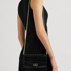 "Find RALPH LAUREN Embossed Leather Adair Crossbody Bag on Editorialist. The Adair crossbody bag is crafted from crocodile-embossed leather. It features a modern chain strap, a compact silhouette, and an array of pockets. The bag is adorned with polished \"LRL\" hardware and a foil-embossed logo, showcasing a signature Lauren Ralph Lauren finish. The Adair can be worn crossbody or on the shoulder. It is a medium-sized bag with a compact design, making it ideal for carrying everyday essentials." Medium Sized Bags, Women Accessories Bags, Black Cross Body Bag, Everyday Essentials, Embossed Logo, Compact Design, Handbag Accessories, Chain Strap, Embossed Leather