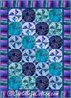 a blue and purple quilt with an abstract design on the front, in shades of teal