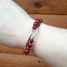 Coil Bangle Bracelet
 	Cranberry Dyed Quartz (semi-precious stone)
 	Silver-plated accents Elegant Red Agate Bracelets, Elegant Red Agate Beaded Bracelets, Elegant Red Beaded Bracelet With Natural Stones, Elegant Healing Beaded Bangle Bracelets, Elegant Red Gemstone Beads Stretch Bracelet, Elegant Red Stretch Bracelet With Gemstone Beads, Elegant Agate Stretch Bracelet Gift, Hand-strung Metal Bracelet For Gift, Elegant Silver Agate Beaded Bracelets