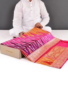 This Banarasi Rangkaat Gold-Silver Zari Kadhuan Brocade Handwoven Katan Silk Saree is a beautiful and versatile addition to any wardrobe. The intricate kadhuan brocade design adds depth and texture to the saree, while the vibrant colors and floral motifs of the Rangkaat pattern make it perfect for any occasion, from weddings and festivals to formal events and parties. The saree is made from luxurious Katan silk, known for its softness, luster, and durability, making it a comfortable and long-lasting investment in traditional Indian fashion. With its mix of traditional and contemporary elements, this saree is perfect for anyone looking to make a statement with their fashion choices. It can be paired with a range of jewelry, shoes, and accessories to create a look that is uniquely your own. Multicolor Pre-draped Saree With Zari Work For Puja, Multicolor Pre-draped Saree With Zari Weaving, Multicolor Katan Silk Pre-draped Saree With Self Design, Festive Multicolor Jamawar Pre-draped Saree, Pink Sherwani For Puja And Diwali, Pink Sherwani For Diwali Puja, Multicolor Jamawar Pre-draped Saree In Traditional Drape, Pink Sherwani With Zari Work For Puja, Traditional Sherwani With Zari Weaving For Ceremonies