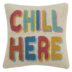 a pillow with the words chill there on it in multicolored letters and beads