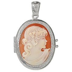 You'll love carrying something personal with you wherever you go! This beautiful locket from Cameo Italiano opens to hold something of sentimental value, such as a photograph or a lock of hair. The pretty piece displays an elegant, hand-carved, 29x22mm shell portrait cameo. Nearly 2" long, it's expertly crafted in your choice of polished sterling silver or 18K yellow gold plated sterling silver. Ornate etch work on the halo and bail add even more beauty. Cameo Medallion Locket Necklace Keepsake, Cameo Medallion Locket Necklace For Keepsake, Keepsake Medallion Locket Necklace With Cameo, Oval Cameo Keepsake Jewelry, Silver Cameo Jewelry For Memorial, Shell Portrait, Lock Of Hair, Hair Locks, The Pretty