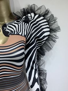 Unleash your wild side with this zebra-inspired strapless jumpsuit featuring a sweetheart neckline and a matching ruffle sleeve shrug, which can be worn together or separately for versatile styling. Made from a stretchy spandex-polyester blend, this jumpsuit offers a sleek bodycon fit that hugs your curves in all the right places. Perfect for making a statement at parties, events, or costume-themed occasions. One size fits most, please refer to the measurements provided below. Sheer Gloves, Upcycling Clothes, Sleeve Shrug, Jumpsuit Fitted, Strapless Bodysuit, Ruffle Jumpsuit, Ruffle Fabric, Zebra Dress, Performance Dresses