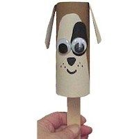 a hand holding an animal shaped popsicle with googly eyes on it's head