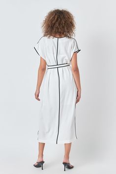 Unleash your inner fashionista with our Contrast Binding Belted Midi Dress. The V neckline and short sleeves create a flattering silhouette while the contrast binding details add an eye-catching touch. The midi length is perfect for any occasion making it a versatile addition to your wardrobe. Made with high-quality materials this dress is comfortable and durable. Wear it with heels for a dressy look or with sandals for a more casual vibe. Upgrade your style game with this must-have midi dress. Shop now and stand out from the crowd! V neckline Short sleeves Contrast binding details Midi length Belted Slit at bottom Slip lining Hand wash cold Do not bleach Iron low Do not tumble dry Shell: 64% Rayon 36% Polyester Contrast: 64% Rayon 36% Polyester Lining: 100% Polyester CK1043D Total length: Modern Short-sleeve Summer Dress, Modern Short Sleeve Summer Dress, White Short Sleeve Midi Dress For Work, White Chic Dress With Contrast Trim, Modern White Midi Dress For Daywear, Modern White Midi Dress For Summer, Chic Midi Dresses With Double-breasted Button Fastening, Summer V-neck Midi Dress With Button Closure, V-neck Midi Dress With Button Closure