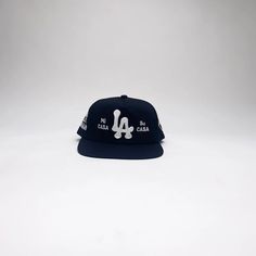 In LA we believe in hospitality. This is our universal way of saying "WELCOME". Unstructured Flat bill mid-profile Five-Panel Snapback cap. 100% Cotton. Spot clean with distilled soapy water.Surfer style hat. One size fits all. Adjustable Snapback Hat With Letter Print And Flat Brim, Adjustable Flat Brim Snapback Hat With Letter Print, Adjustable 5-panel Fitted Hat With Embroidered Logo, Adjustable 5-panel Fitted Hat For Baseball Season, Urban Snapback Hat With Letter Print And Flat Bill, Urban Snapback Hat With Letter Print And Flat Brim, 5-panel Cotton Snapback Hat For Baseball Season, Adjustable 5-panel Baseball Cap For Streetwear, Baseball Season Snapback Hat 5-panel