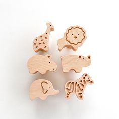 wooden toy animals on white background with clippings