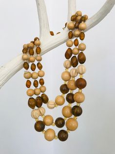 1950s - 60s vintage 3 strand beaded necklace. Light colored beads are wooden, and darker ones are amber colored (faux amber) lucite, with small glass beads in between. Wonderful vintage quality.  Shortest strand length - 16.25" - 17.75" (adjustable closure)  Lower two strands hang down below. Longest strand length - ~18.5"  All jewelry Costume Jewelry unless otherwise indicated.  Feel free to contact me with any questions! See my shop for other listings - combined shipping available.  *All items are vintage - See photos for condition!!  **Currently shipping purchased items once a week (so it could be up to 5 business days before your item ships). I wear gloves when packing items, and at the post office, for your safety & peace of mind. Thanks for your patronage & patience during this time! Beaded Necklace Designs, 60s Vintage, Amber Color, Multi Strand Necklace, Glass Bead Necklace, Strand Necklace, Multi Strand, Glass Bead, Bead Necklace