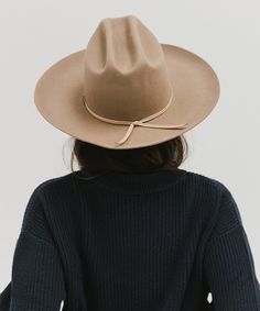 Ezra blends statement fashion with Western. A classic cattleman crown made to be styled for the city as much as the countryside. This hat features an upturned brim + a tall crown, giving Ezra a modern + feminine feel. Ezra comes with a removable tonal grosgrain band featuring a brass Gigi Pip pin. Other bands pictured are sold separately. Classic Curved Brim Hat For Fall, Fall Flat Brim Top Hat, Classic Wide Brim Panama Hat For Fall, Classic Spring Felt Hat With Flat Crown, Classic Flat Crown Felt Hat For Spring, Spring Classic Felt Hat With Flat Crown, Fitted Felt Hat With Flat Crown For Spring, Fitted Short Brim Hat For Fall, Fitted Fall Hat With Short Brim