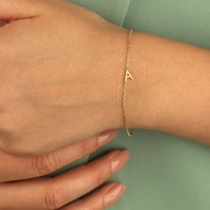 18k Gold Initial Bracelet, Personalized Bracelet, Family Initial Bracelet, Christmas Gift, Mini Letter Braceler, Gift For Women, Bracelet Celebrate your loved ones with our elegant 18K Gold Initial Bracelet, a timeless piece that brings a personal touch to any jewelry collection. This dainty bracelet features mini initial charms that can be customized with the letters of your choice, making it the perfect gift to symbolize family, friendship, or a cherished memory. Features: Material: High-quality 18K gold plating for a luxurious, long-lasting shine. Personalization: Customize with up to 5 initials, perfect for representing loved ones. Design: A minimalist, delicate chain that complements any outfit, from casual to formal. Fit: Adjustable length for a comfortable, tailored fit. Charm Size: Bridesmaid Bracelet Gift, Initial Bracelet Gold, Garnet Birthstone, Bracelet Initial, Bracelet Christmas, Gift Bracelet, Personalized Bracelet, Etsy Bridesmaid Gifts, Women Bracelet