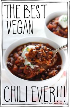 the best vegan chili ever is in a white bowl with sour cream on top