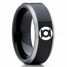 a black and silver ring with the letter i on it