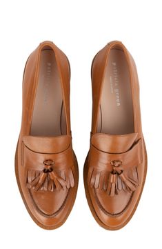 A lug sole lends an extra-toothy bite to a street-savvy leather loafer with a classic tassel detail on the fringed vamp. 1" heel Removable, cushioned insole with arch support Leather upper and lining/rubber sole Made in Spain Loafer Women, Contemporary Chic, Business Attire, Lug Sole, Leather Loafers, Loafers For Women, Arch Support, Cognac, Women's Shoes