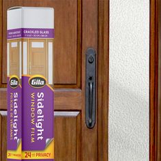 two rolls of glue sitting on top of a wooden door