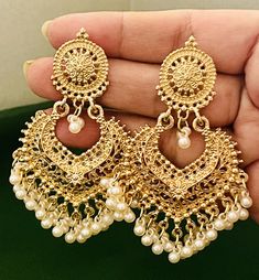 Beautiful indian pakistani drop doen earings .golden colour with pearls Please keep in mind that the colour of the product shown in the pictures may vary from the original due to the lighting used. Care Instruction : Avoid Heat & Chemicals Like Perfume, Deo, Alcohol, Etc. | Clean With Dry Cotton Cloth | Pack In An Air Tight Container After Use. Traditional Gold Plated Earrings With Pearl Chain, Diwali Pearl Gold Earrings, Traditional Gold-plated Earrings With Pearl Chain, Traditional Gold Earrings With Pearl Chain, Gold Meenakari Drop Pearl Earrings, Traditional Chandbali Earrings With Pearl Chain, Bollywood Pearl Chain Earrings For Festive Season, Festive Bollywood Pearl Chain Earrings, Gold Bollywood Pearl Drop Earrings