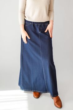 With the look of real denim but the feel of soft knit, comfort is the key element in our Caroline skirt. The quick, effortless pull-on style makes this skirt an effortless option for every day. Larger waist-size? The elastic waistband gives stretch without feeling bulky. A skirt like this will take you through the day, from grocery shopping to making dinner, or even a quick coffee shop visit for a chat with a friend over lattes! This skirt has become a best-seller. Style: elastic waist, soft knit fabric, functioning back pockets Color: navy denim Fabric content: 65% Cotton, 30% Polyester, 5% Spandex Care instructions: wash gentle cycle, cold; lay flat to dry, cool iron if needed. Our sizing is always approximate and can also vary due to personal preference and body shape. Please allow a 1" Making Dinner, Quick Coffee, Be Intentional, Knit Maxi Skirt, Long Knit, Curated Gifts, Grocery Shopping, Body Shape, Denim Fabric