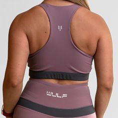 MATERIAL: 63% nylon/37%spandex FIT: ﻿True to size. DESIGN: Sports bra with scoop neckline. Medium support bra. Added zipper in the middle of the chest. Available in purple/black and gray/black. MODEL: Model is 5'5", 120 lbs, wearing a size Medium. WASHING: We recommend washing inside-out on a cold setting. Hang to dry. This sensational sports bra is designed to elevate your workout and give you confidence in the gym. Crafted with a chic scoop neckline, this medium support gym bra embraces your c Nylon Scoop Neck Sports Bra For Gym, Nylon Scoop Neck Sports Bra For Workout, Purple Nylon Activewear For Gym, Nylon Scoop Neck Sports Bra For Sports, Scoop Neck Nylon Sports Bra, Functional Scoop Neck Sports Bra For Gym, Functional Scoop Neck Sports Bra For Training, Purple Racerback Sports Bra For Workout, Purple Compression Sports Bra For Workout