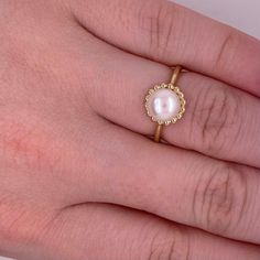 This lovely cultured pearl ring is the perfect gift for a loved one or a great self purchase. The nice size pearl has a gold beading design that is very simple but elegant. The pearl is the most desirable color with a nice white color with rose hues. This ring is a size 6.5 but is sizable. Just let our shop know what size your need and our in house jeweler can take care of that. The details for this beautiful ring are listed below:Metal Quality: 14 K Yellow Gold Gemstone: Freshwater Pearl Gemsto Luxury Everyday Yellow Gold Pearl Ring, White Akoya Pearl Ring With Pearl Drop, Wedding Pearl Rings With Pearl Pendant, Anniversary Pearl White Rings With Pearl Charm, Anniversary Rings In Pearl White With Pearl Charm, Pearl White Rings With Pearl Charm For Anniversary, Elegant Pearl Drop Ring As Gift, Wedding Pearl White Ring With Pearl Charm, Pearl White Wedding Ring With Pearl Charm