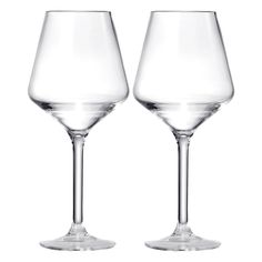 two empty wine glasses sitting next to each other