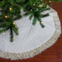 a christmas tree skirt on top of a wooden table