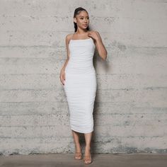 Be a sassy trendsetter in this sexy white midi dress with ruching and spaghetti straps! The body con fit will hug your curves, making sure you're the best dressed in the room! Perfect for any summer event or night out! Fabric: 65% RAYON 30% MODAL 5% SPANDEX Fit: True to size S fits sizes 2-4 M fits sizes 6-8 L fits sizes 10-12 Model is wearing a size Small White Ruched Cotton Midi Dress, Affordable White Ruched Bodycon Dress, White Ruched Midi Bodycon Dress, White Midi Dress With Ruched Detail And Straight Neckline, White V-neck Ruched Bodycon Dress, Dress With Ruching, Midi Bodycon Dress, White Midi, You're The Best