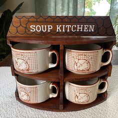 there are many cups stacked on top of each other in the cup kitchen display case