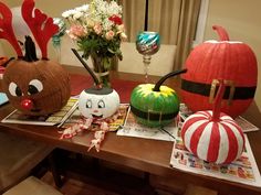 some pumpkins and other decorations on a table