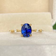 a ring with a blue stone in it