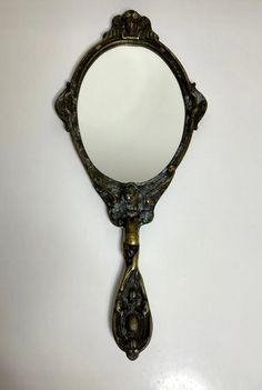 an antique looking mirror on the wall