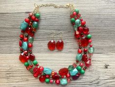 Great jewelry for the holiday season! Various shades of red and green acrylic beads in our signature confetti style :) Necklace is approximately 16 inches long plus a 4 inch extender chain.  Earrings are a single bead on a fishhook as shown.  I make these in ANY and ALL color combinations for your child's teams, college, pro team, sorority, place of work, or just any of your favorites! These make great, affordable bridesmaid necklaces for weddings as well. Just message me with your wedding colors and I will make you a sample.  *Smoke and pet free home!* I ship 6 days a week! Thank you for browsing my store! Festive Beaded Holiday Jewelry, Red Beaded Jewelry For Gifts, Beaded Jewelry For Christmas Holiday, Red Jewelry With Colorful Beads For Gift, Gift Red Jewelry With Colorful Beads, Holiday Festive Jewelry With Colorful Beads, Holiday Party Beaded Jewelry, Festive Holiday Jewelry With Colorful Beads, Festive Holiday Beaded Jewelry