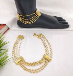 "Kundan Payal/Kundan Anklets/Indian Payal/Indian Anklets/Indian Jewelry/Polki Payal/Sabyasachi Payal/Pajeb/Indian Jewelry/Indian Bridal Payal Features: - Length: 10\"-11\" - Indian Kundan Anklets in Golden finish. - Very Elegant and stylish, this set can be paired with any Attire depending upon the occasion and the theme. - The base is pure brass which makes this very sturdy and of good quality. - 100% guarantee on the polish- it will not lose its finish/color/shine. - Very lightweight and Hand White Latkans Anklet For Festive Occasions, White Latkans Anklets For Festive Season, Festive White Anklets With Latkans, White Festive Anklets With Latkans, Festive White Latkans Anklets, Indian Payal Aesthetic, Kundan Anklets For Wedding And Diwali, Kundan Payal Anklets, Indian Payal Anklet