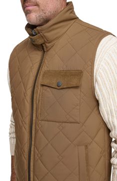 Water-resistant construction and a quilted body offer exceptional comfort in a rugged, versatile vest. 27" length Stand collar Water-resistant 100% polyester Machine wash, tumble dry Imported Brown Vest Outerwear For Outdoor Activities, Quilted Nylon Vest For Cold Weather, Quilted Nylon Functional Vest, Functional Quilted Nylon Vest, Sleeveless Brown Outerwear For Outdoor, Sleeveless Outdoor Outerwear With Padded Collar, Sleeveless Outerwear With Padded Collar For Outdoor, Outdoor Nylon Vest With Padded Collar, Nylon Vest With Padded Collar For Outdoor