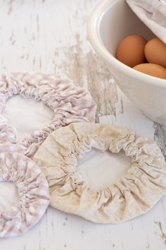 two scrunffles are next to a bowl of eggs